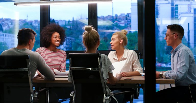 Multiethnic startup business team in night office